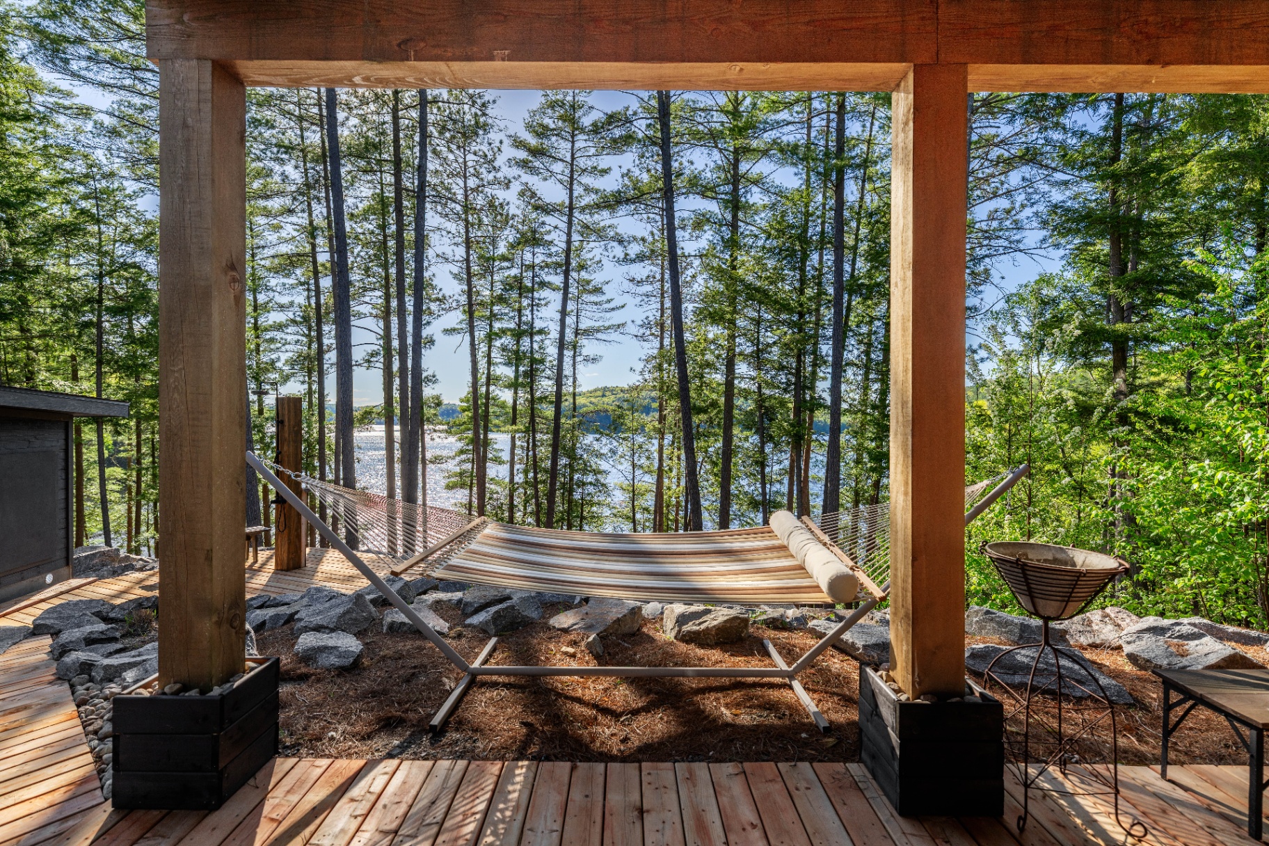 Hammock framed by timber posts overlooking Redstone Lake