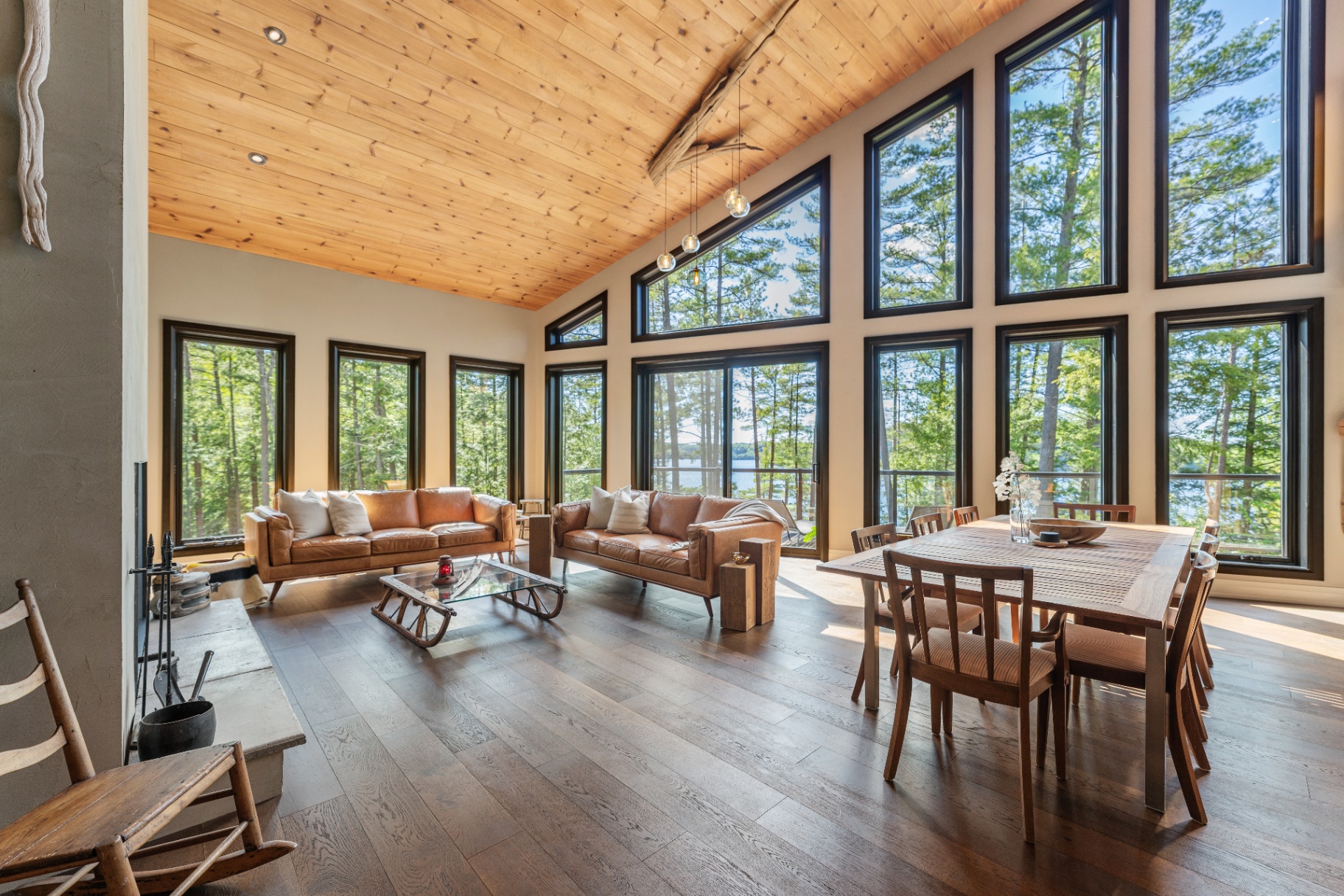 Open-concept living and dining room with lake views