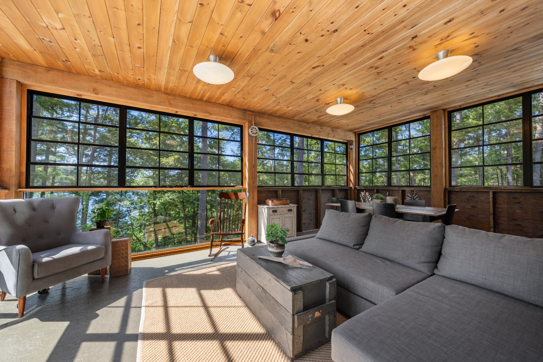 Screened porch lounge with vaulted cedar ceiling