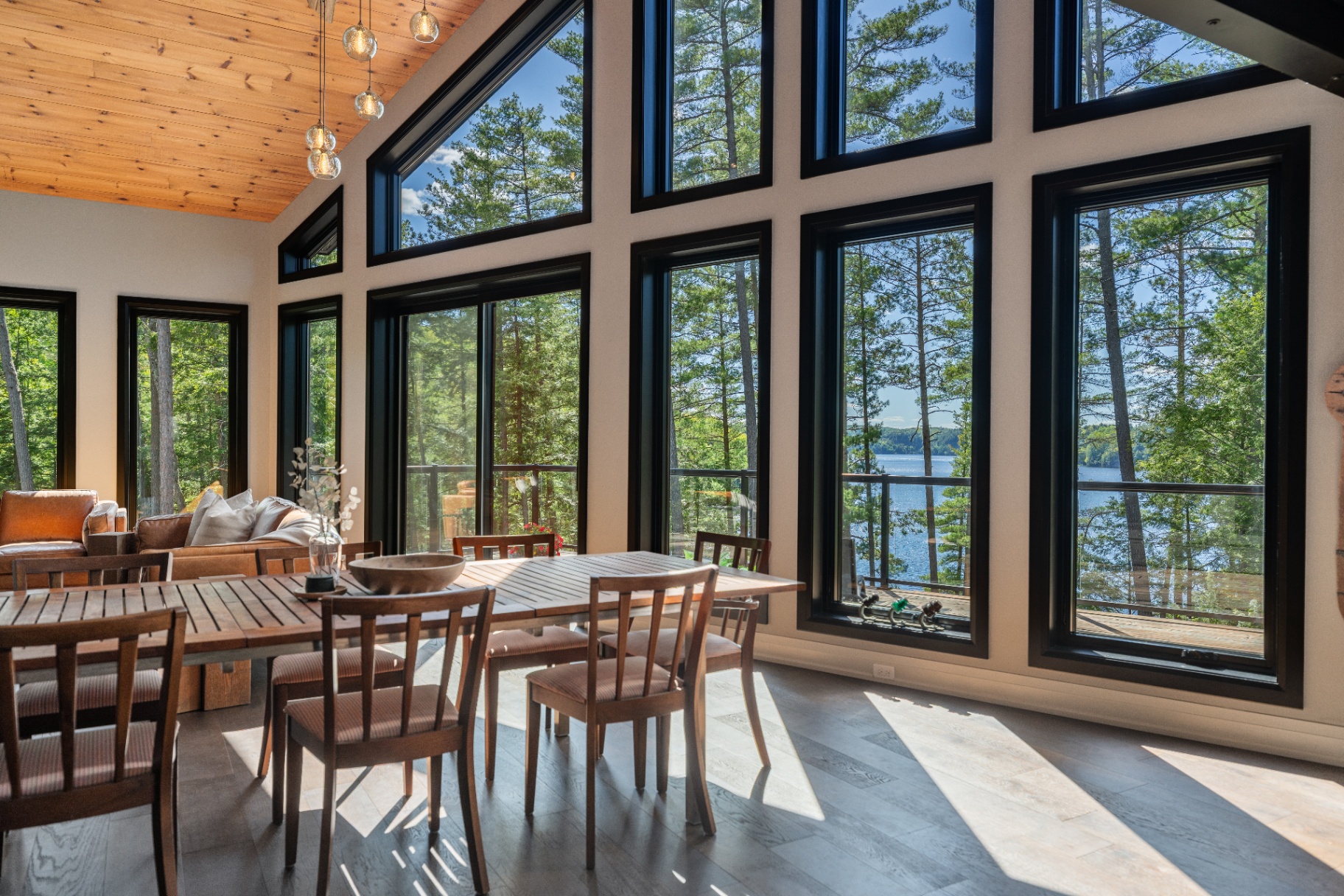 Dining area with panoramic lake and forest views