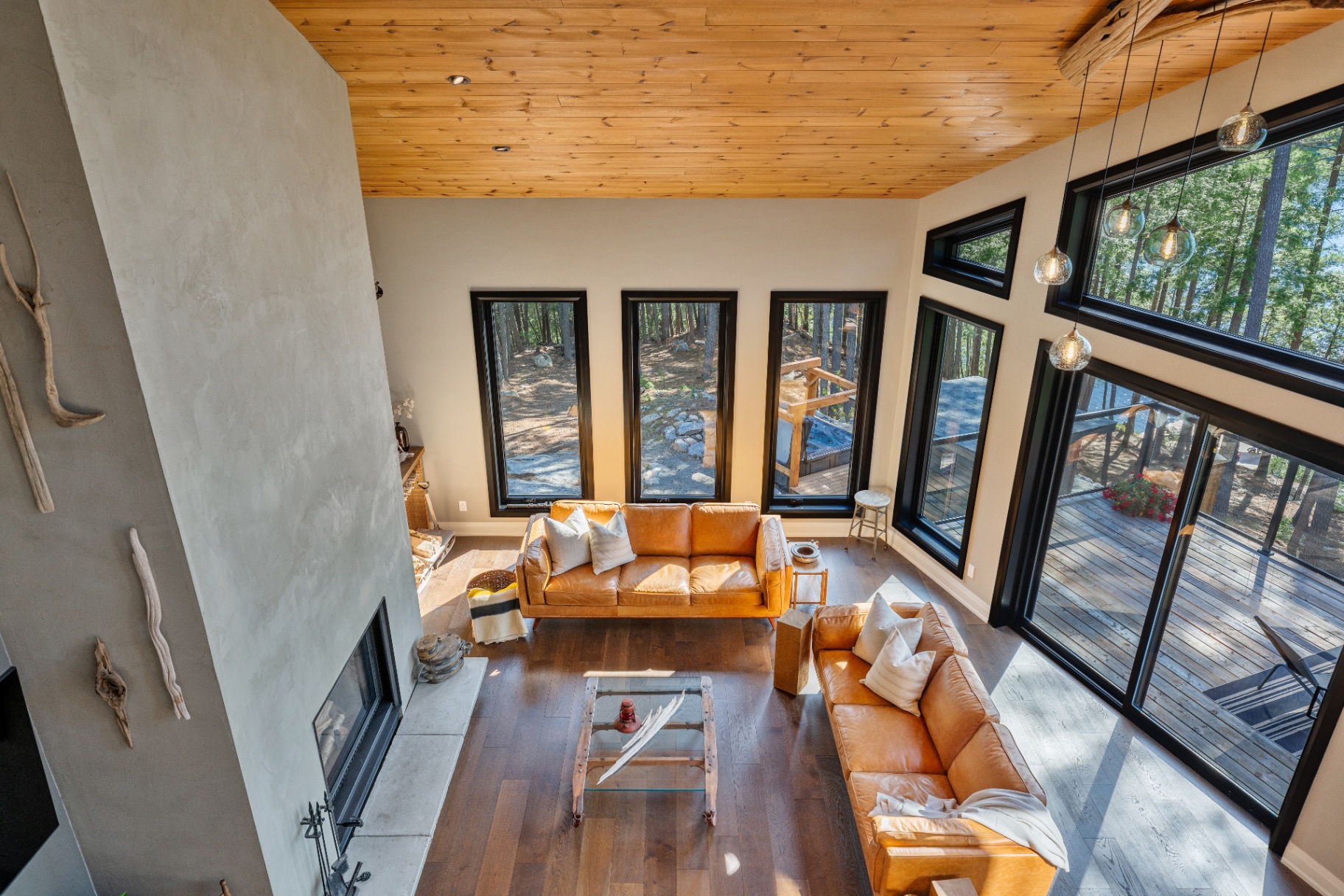 Mezzanine view of the living room with plaster fireplace