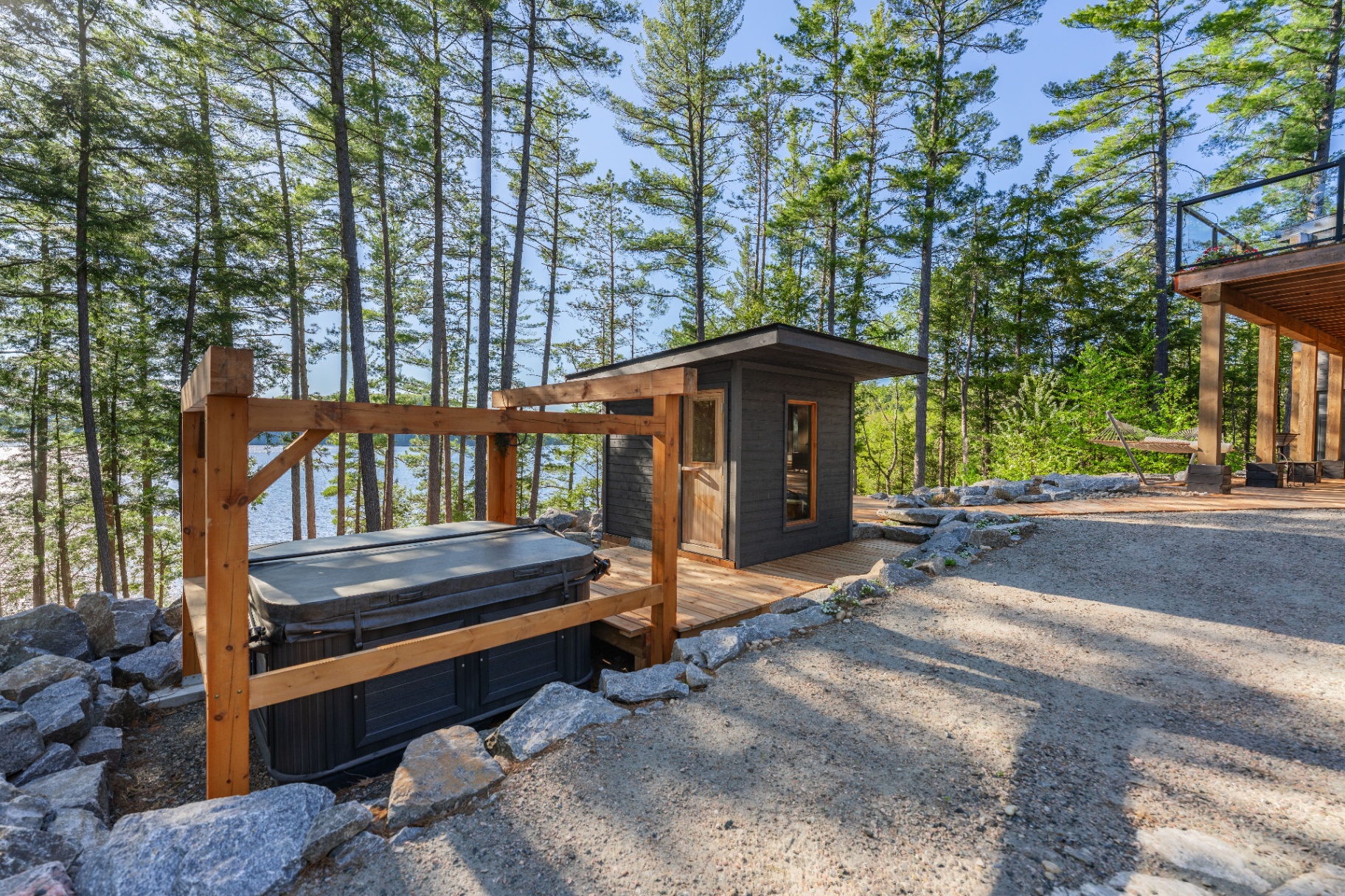 Sauna and hot tub area beside the house on the upper terrace