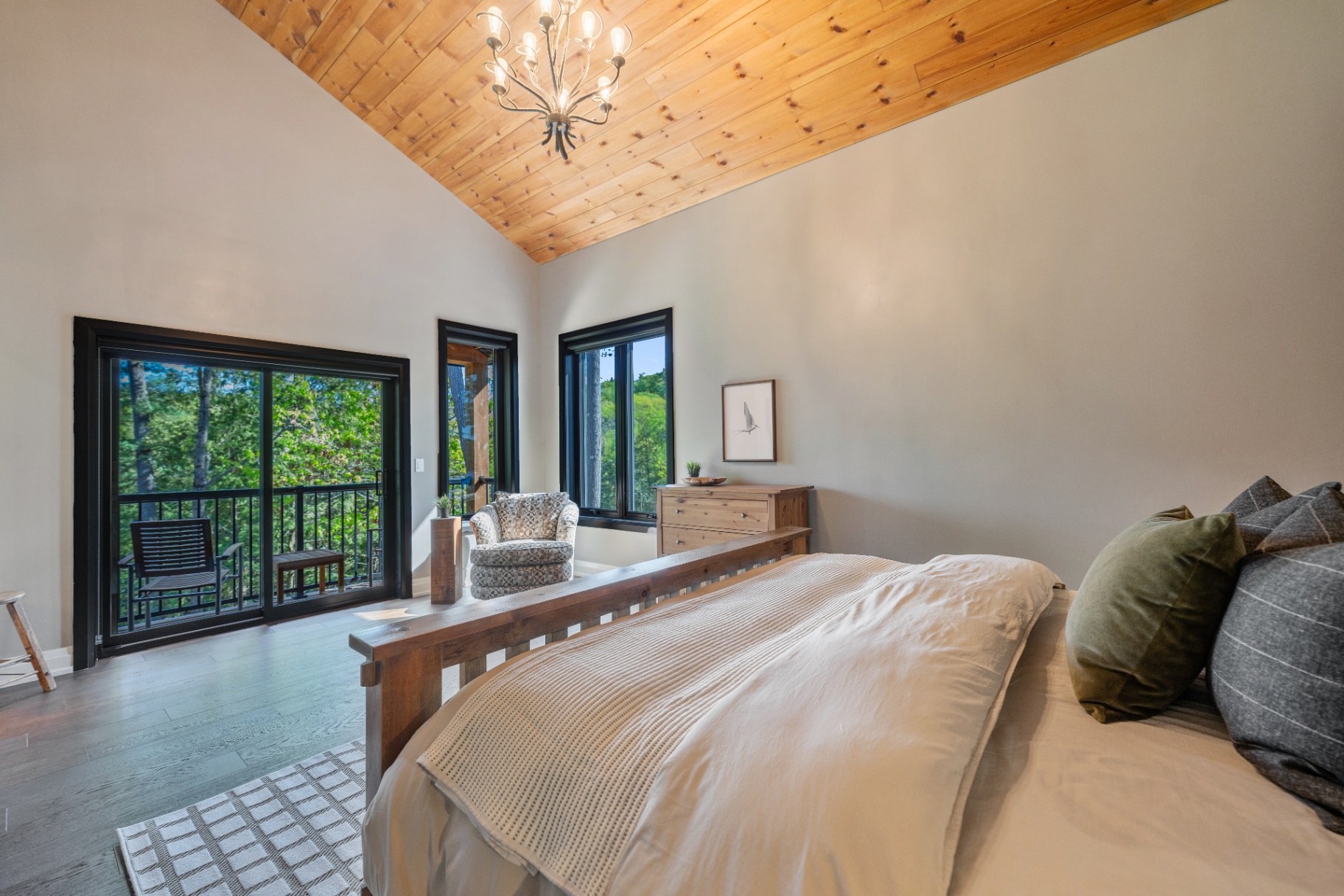 Primary bedroom opening to a private balcony