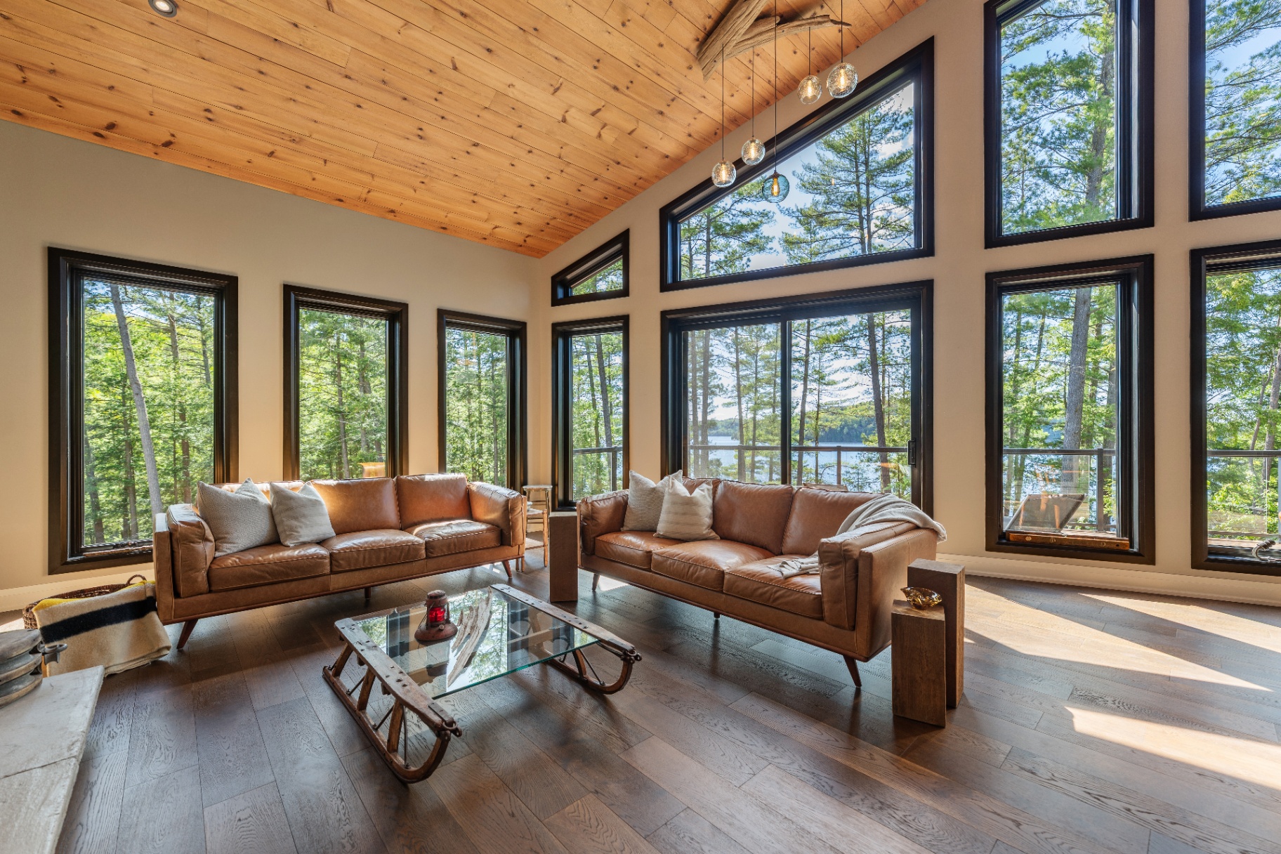 Seating area with panoramic windows overlooking the lake