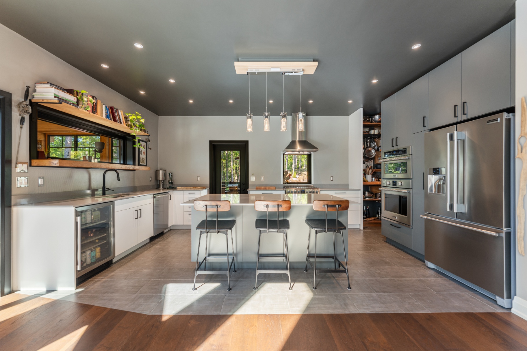 Modern kitchen with central island and pendant lights