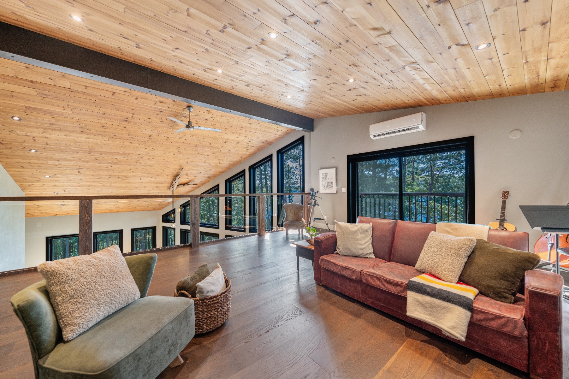 Loft sitting area with leather sofa and music corner