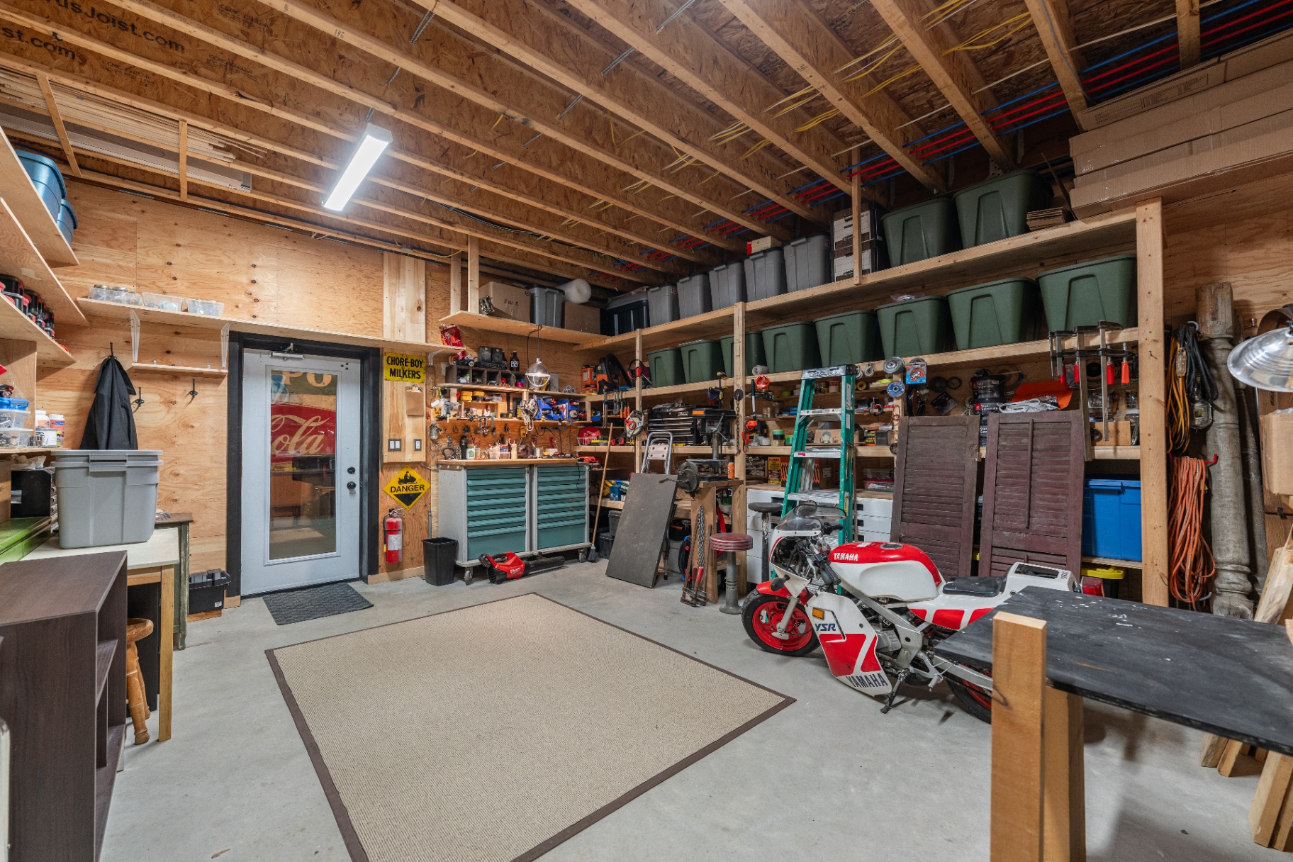 Workshop and storage space with workbench and vintage mini bike