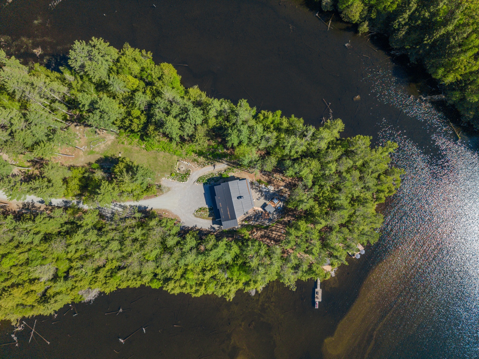 Straight-down aerial showing the full peninsula site and private dock
