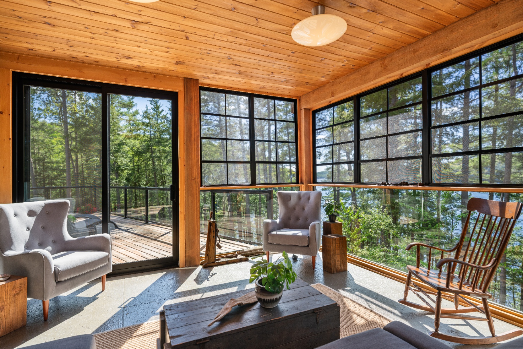 Screened porch corner with rocker and deck access
