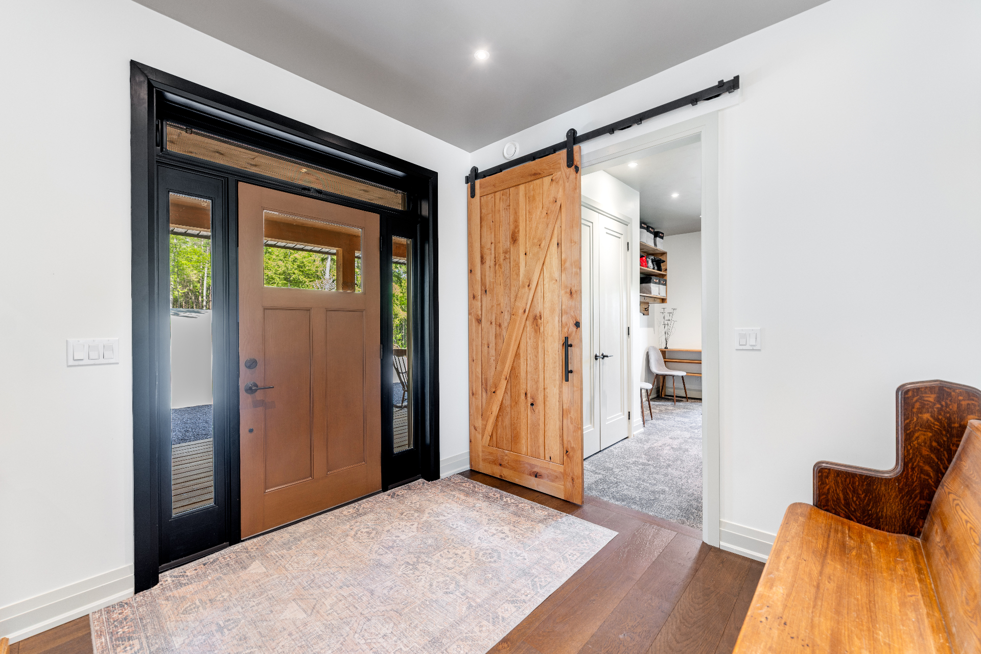 Interior foyer with sliding barn door
