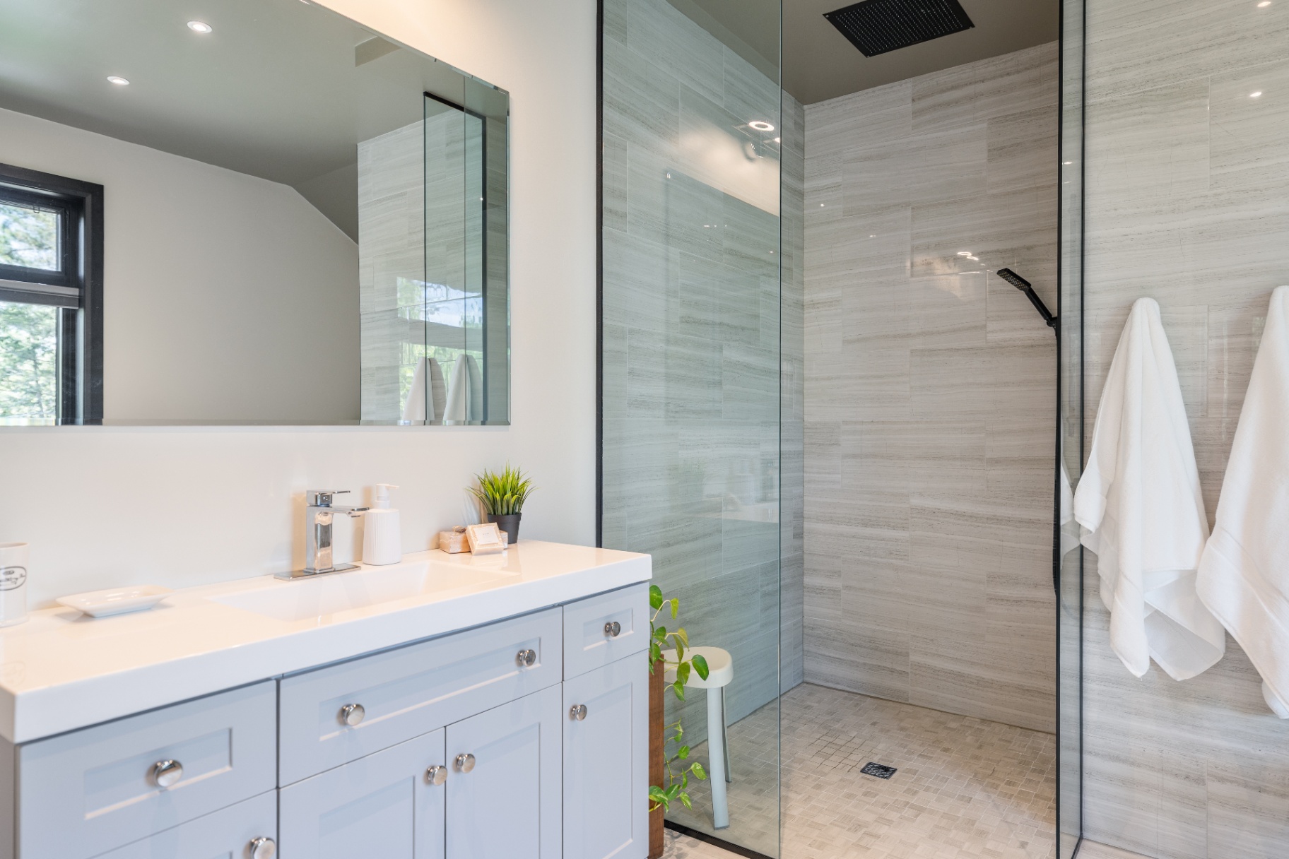 Close view of the ensuite vanity and shower enclosure