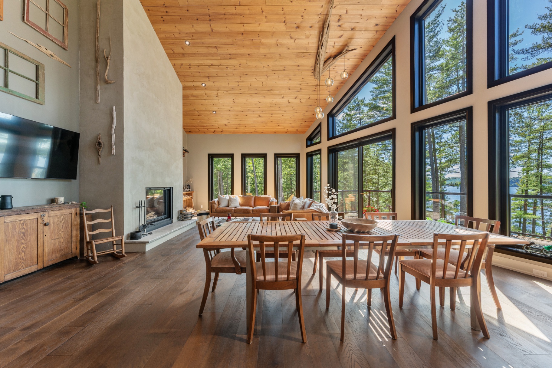 Dining area beside the fireplace and lake-facing windows