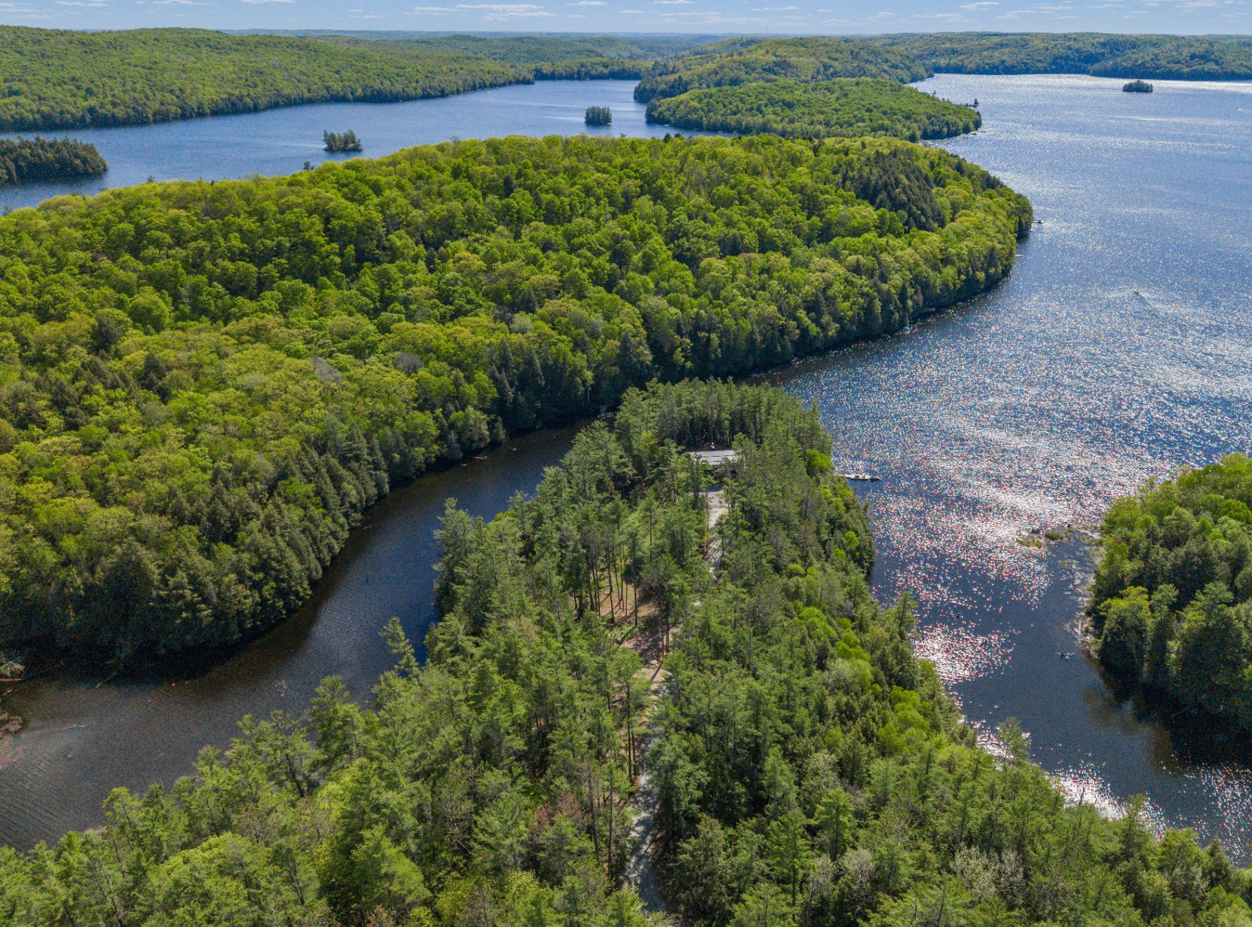 High aerial revealing the property set at the meeting of two waterways
