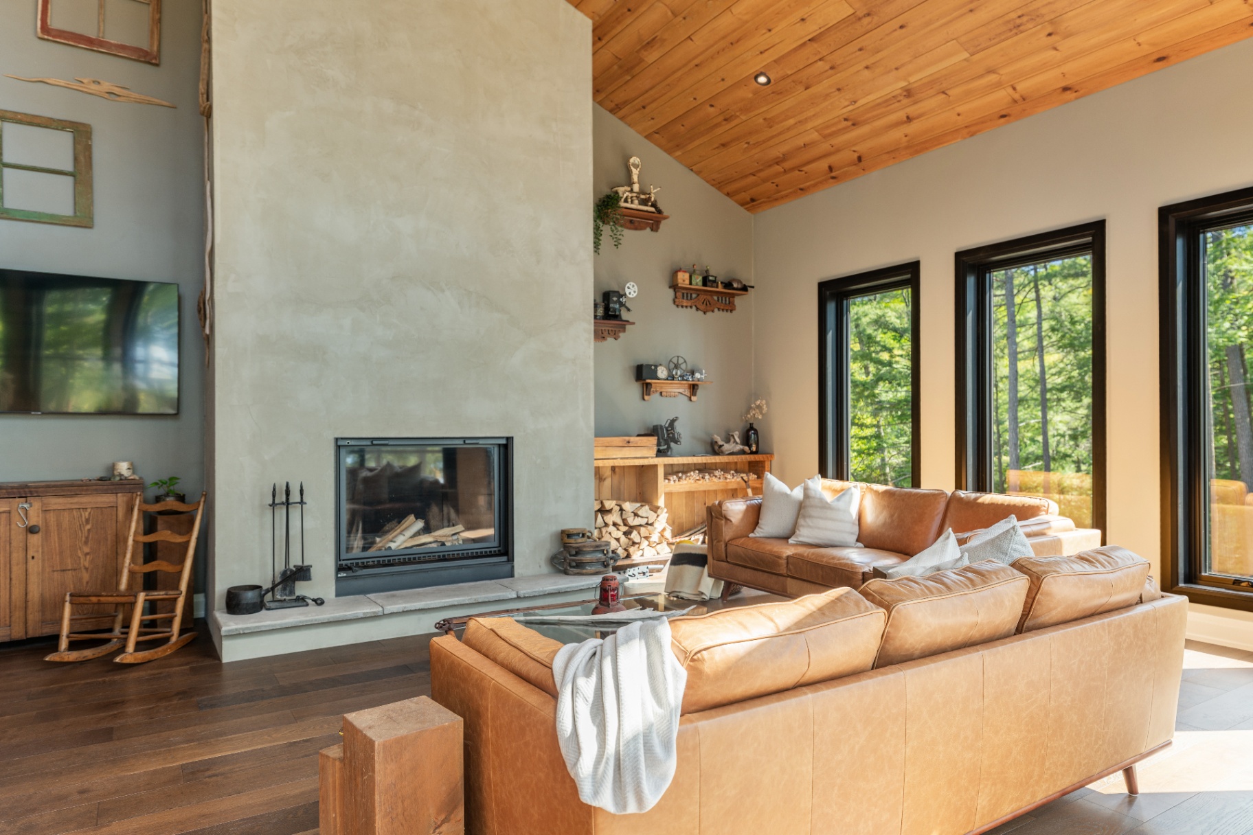 Living room anchored by a plaster fireplace
